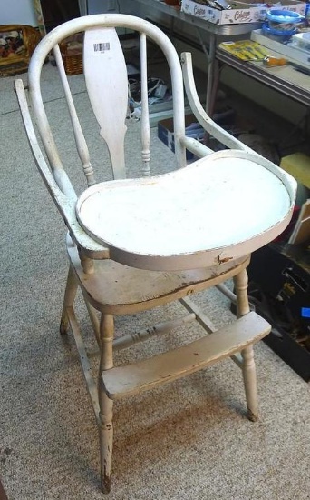 Really cool old high chair is still sturdy and in overall good condition.