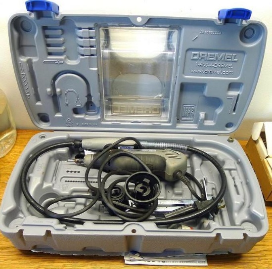 Dremel 400 XPR with case, flexible extension, some bits, manual, etc. Turns on.