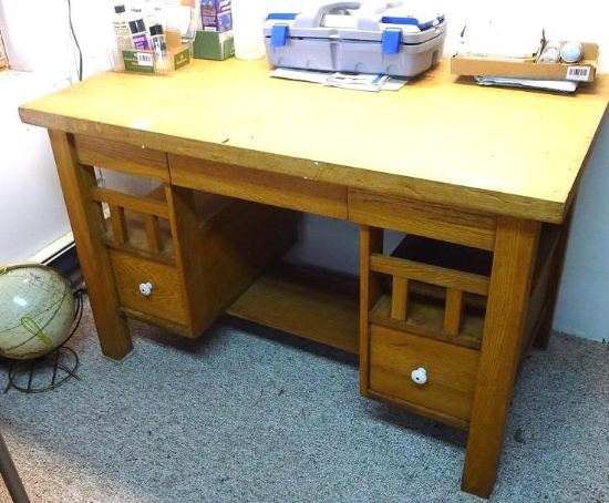 Oak library table has plenty of storage, measures 4' wide x 28" x 30" high.