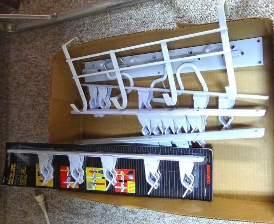 New in package, plus two other spring grip organizers and a 14" over the door hook.