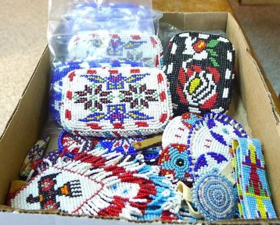 Seven beaded belt buckles are each 3" x 4"; a few beaded barrettes, plus a few other pieces.