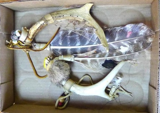 Whitetail deer antlers have been decorated with fur, feathers and leather. Each is approx. 8".