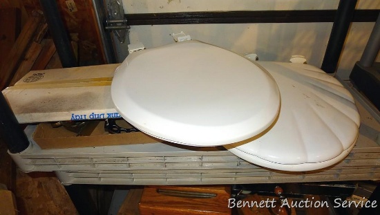 Scalloped shell and other toilet seat, brass toned bath fixtures, condensation drip pan.