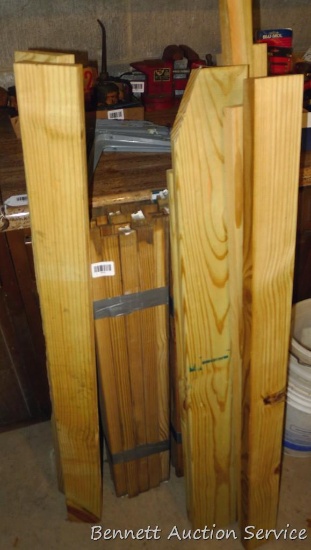 Treated and other wood pieces up to 5', plus a bundle of 36" deck or stair spindles.