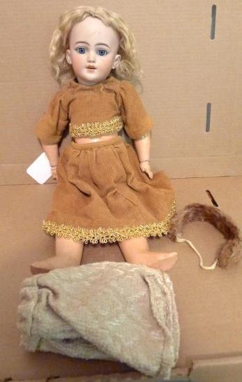 Antique doll has bisque socket head, S&H, jointed composition body. 19" overall. Eyes still open and