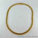 Gold toned necklace has a clasp that is marked '14 KT Italy'. 7-1/2