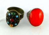 Two vintage costume jewelry rings. Ring with red accent is size 7; other is 6.
