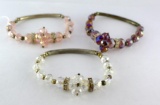 Three pretty sparkly beaded bracelets with elastic. Note on tag states 'Crystal'.