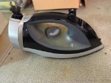 Hamilton Beach iron has retractable cord. Heats up, model No 14210.