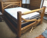 Queen sized log bed frame is in overall good condition, some branch pieces need to be reattached to