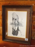 Nicely matted and framed signed print by Noel Smith '77. Measures 19