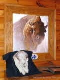 Buffalo print by Robert Bateman, and white buffalo print on fabric; print famed and matted measures