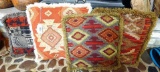 Four throw pillows; largest measures 19