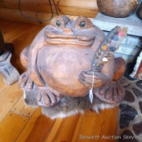 Impressive carved wooden frog sitting on a deer skin; frog measures 24