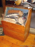 Wooden firebox filled with wood; measures 29-1/2