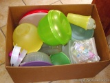Box filled with Tupperware containers.