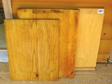 Three large wooden cutting boards. Largest is 18