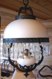 Pretty cast iron framed hanging oil lamp is about 24