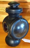 Ford-O carriage or early automobile lantern has a clear front lens and a red side lens. Burner is