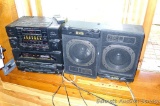 Soundesign AM/FM radio has dual cassette decks and remote; includes two Soundesign Expanded Bass