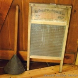 National No 862 washboard and a laundry plunger. Washboard has glass board and is about 24