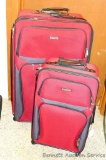 Two Prot?g? suitcases, both with swivel casters and handles - plus a small tote bag. Larger is 32