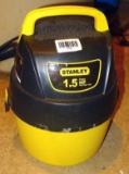 Cute little Stanley wet/dry vac looks to be about a one gallon unit. Comes with attachments as