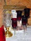 Wire and glass candle holder set in original box; plus a set of four stemmed votive holders, tallest