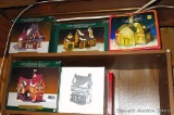 Five lighted Christmas village pieces with original boxes.