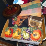 Eight wooden chargers with a nice leaf pattern and matching napkin rings; fall themed table cloth,