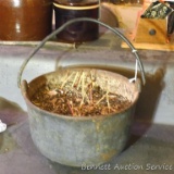 Vintage heavy cast metal ash bucket. Has a bent handle and some rust but in otherwise nice