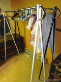 Two clothes racks are each approx. 5' wide. Come with some hangers.