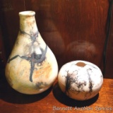 Two funky ceramic vases by Irene Gimeno. Both have a textured, semigloss exterior. Bulb vase