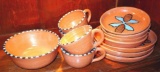 Twelve pcs. of Southwestern style dinnerware by Irene Gimeno. One piece has a repair on it, but all