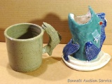 Ceramic fish mug and pen holder by Irene Gimeno. Pen holder has a break on the fin. Mug in good