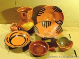 Seven pcs. of orange colored ceramic pottery, most by Irene Gimeno. Some pieces have paint loss. No