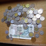 Foreign coins and currency as pictured.