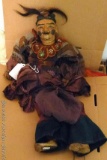 Very old string puppet stands 2' tall. Dress has some damage, we think it has real hair. Smells a