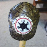 Beaded turtle shell is mounted on a 4' wooden handle.
