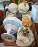 Decorative pieces including musical figurine, kissing angel figurines, footed dish. Musical figurine