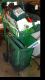 4' garden cart with a bunch of gardening and lawn tools and supplies.