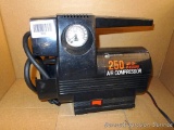 12 volt air compressor with flashlight by Interdynamics.