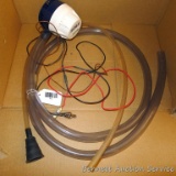 Attwood V625 12 volt bilge pump with hose.