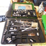 Assorted wrenches, sockets, and more as pictured.