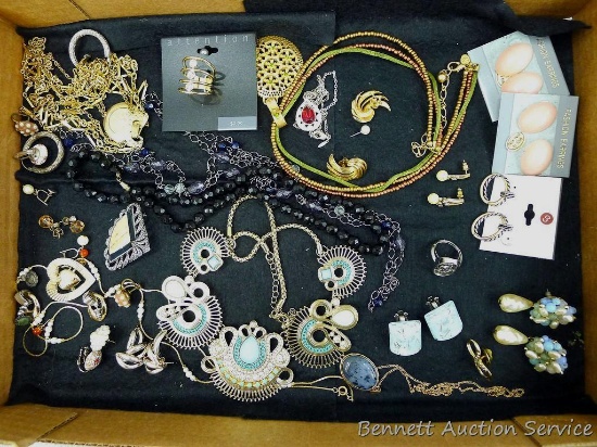 Lots of ear rings, necklaces, pins and rings.