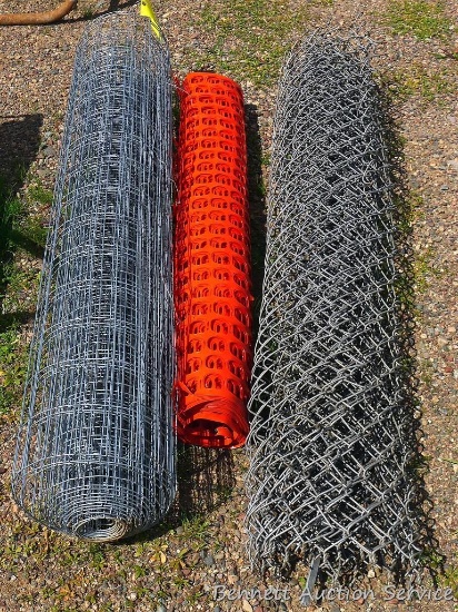 Roll of chain link fence 66" tall; roll of plastic fence 49" long x 6" diameter; roll of 5' x 11"