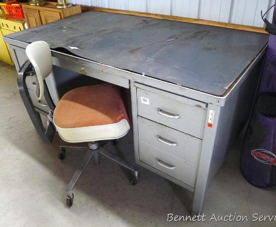 Solid Art Metal desk with a comfortable rolling office chair. Desk is 60" x 34" x 30-1/2" high. None