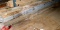 Several large lumber beams up to 6