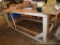 Sturdy wooden work bench. Frame is 82