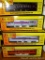 Four Rail King model trains with original boxes. All trains look to be in good condition, boxes are